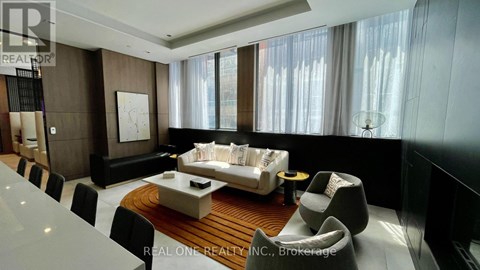 A modern living room with a large sofa and a coffee table.