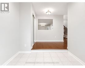 A room with a wooden floor and white walls.