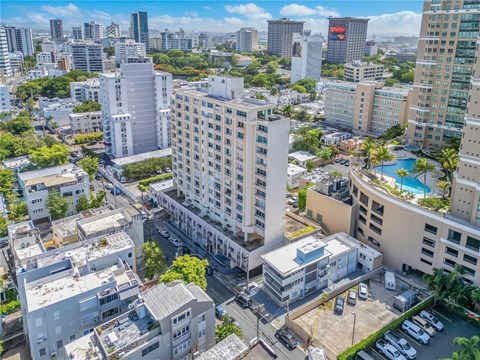 A cityscape with a mix of residential and commercial buildings.