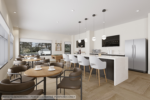 A modern kitchen with a dining table and chairs.