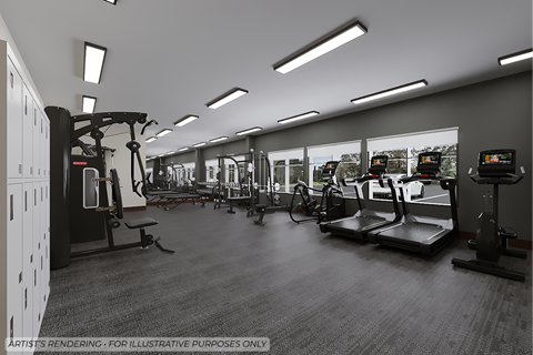 A black and white image of a gym with various exercise equipment.