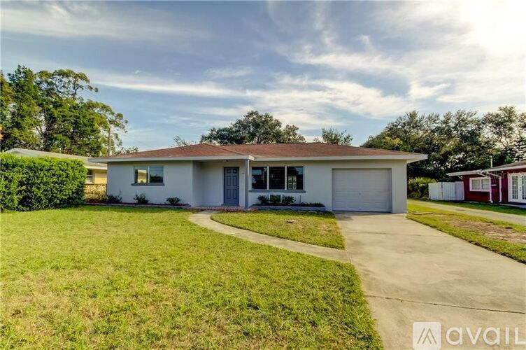 A house with a driveway in front of it is for sale.