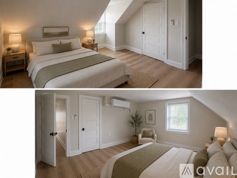 A bedroom with a large bed and a smaller bed in the attic space.