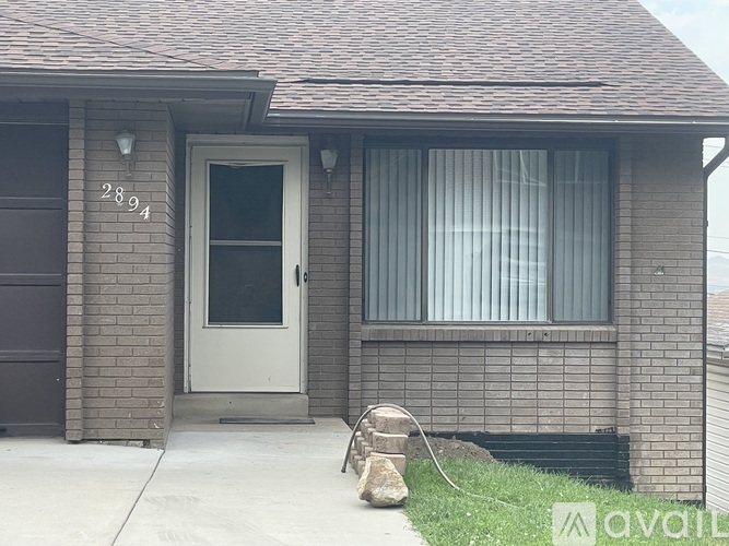A house with the number 2894 on the wall.