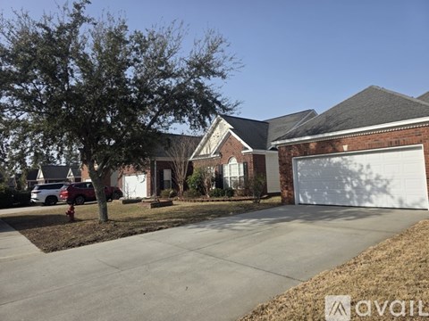 A house with a garage door is for sale.