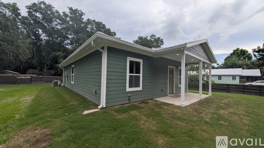 A small house with a porch is available for rent.