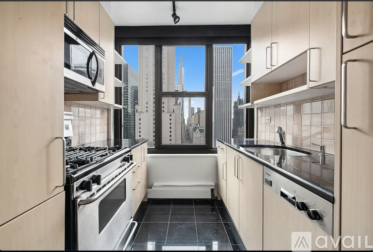 A modern kitchen with a view of the city.