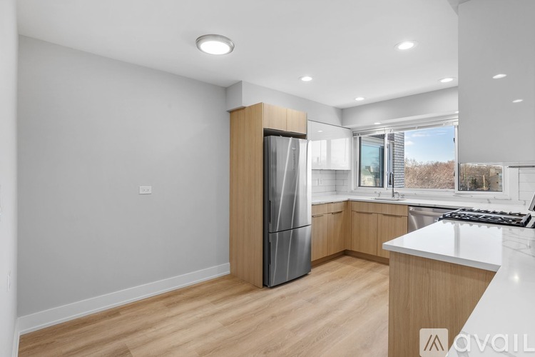 A kitchen with a refrigerator, stove, and oven.