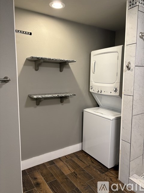 A white oven and microwave in a small kitchen.