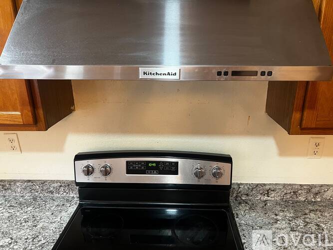 A KitchenAid stove top oven with a digital display and control panel.