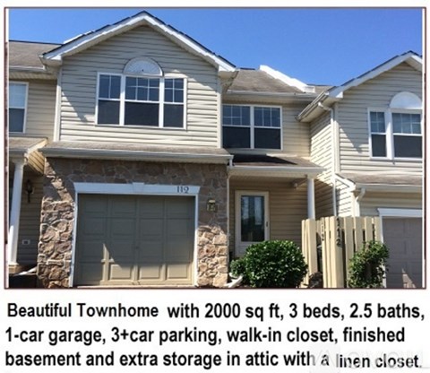 A large townhome with a garage and a walk-in closet.