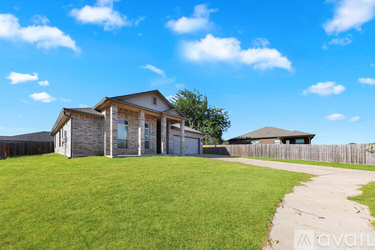 A house with a front yard is for sale.