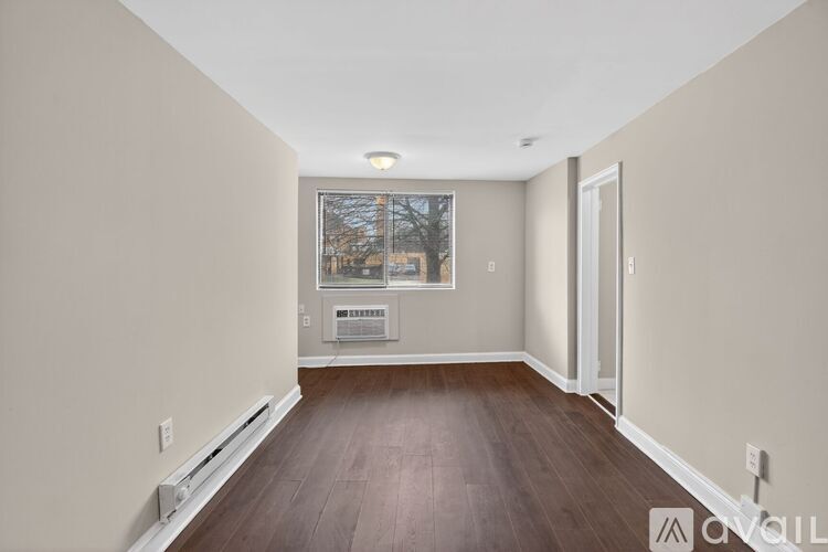 A room with a window and a door.