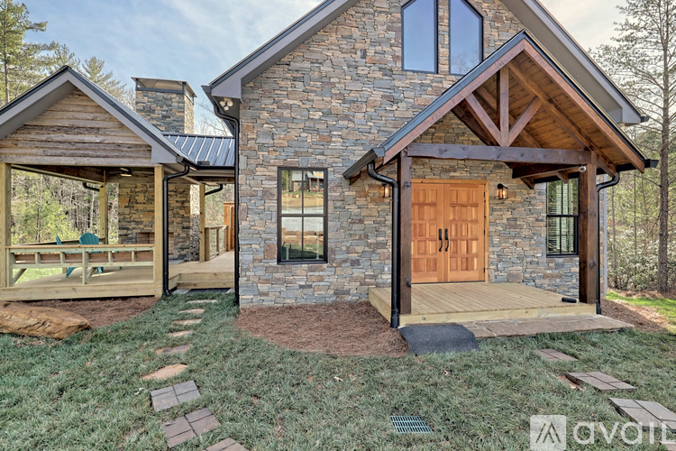 A house with a stone exterior and a wooden door.
