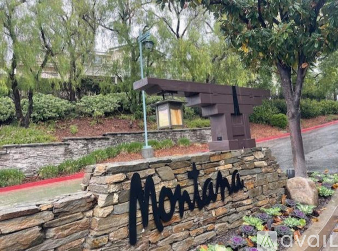 A stone wall with the word Montana written on it.