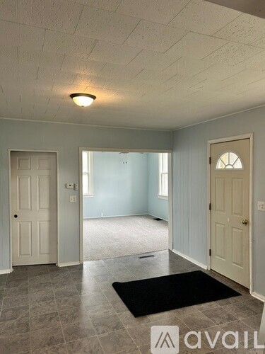 A room with a door and a window.