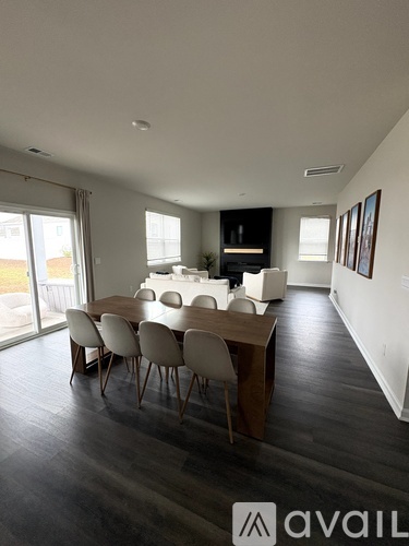 A dining room with a table and chairs is shown.