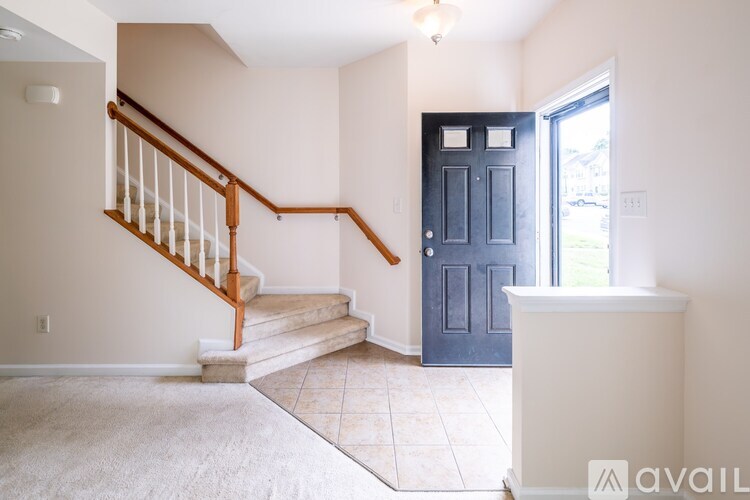 A room with a staircase leading to the second floor.