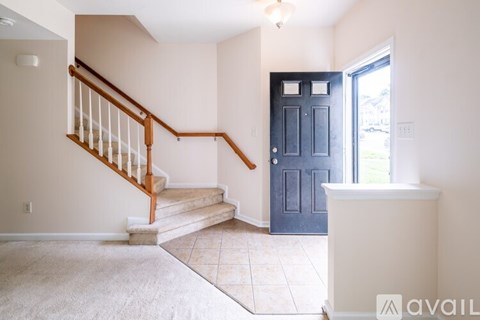 A room with a staircase leading to the second floor.