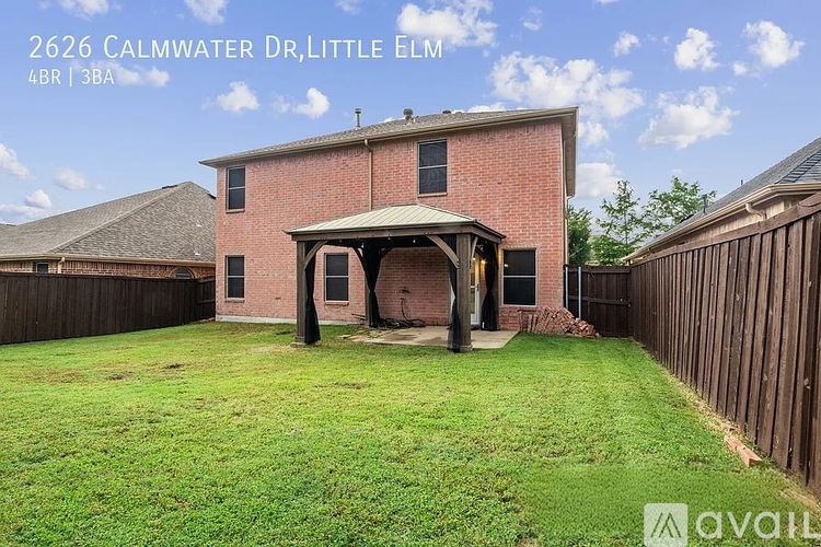 A house with a red brick exterior and a covered patio is for sale at 2626 Calmwater Dr, Little Elm.