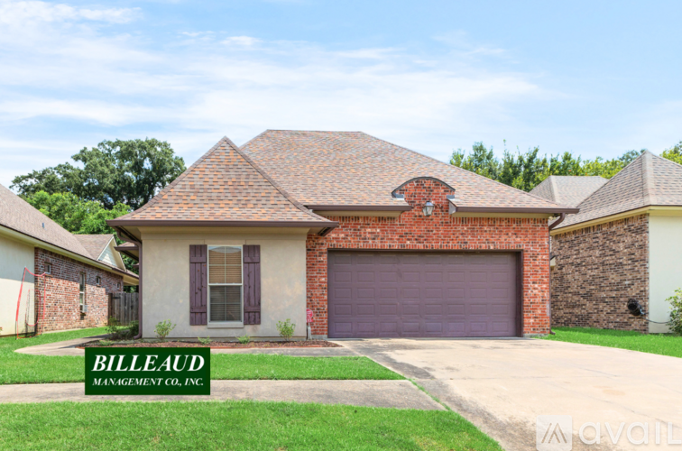 A house with a sign that says Billeaud Management Co. Inc. in front of it.