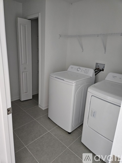 A laundry room with a washer and dryer.