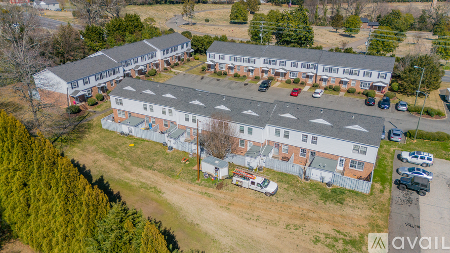 A large building with a parking lot in front of it.