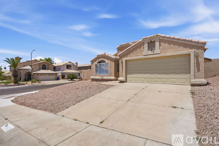 A house with a garage is for sale.