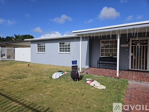 A house with a blue and white exterior is for sale.