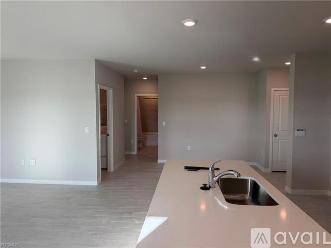 A modern kitchen with a sink and a countertop.