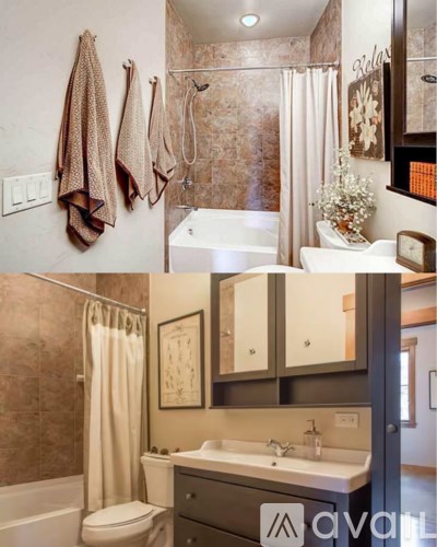 A bathroom with a toilet, sink, and shower.