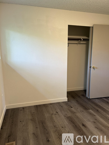 A room with a door and a wall.