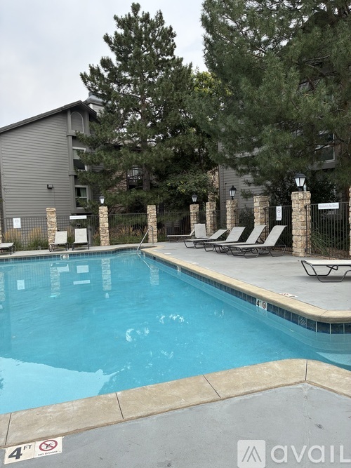A pool with a 4 feet no swimming sign.