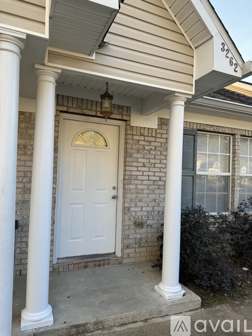 A house with a white door and a window is for sale.