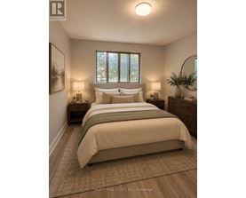 A bedroom with a large bed and two lamps.