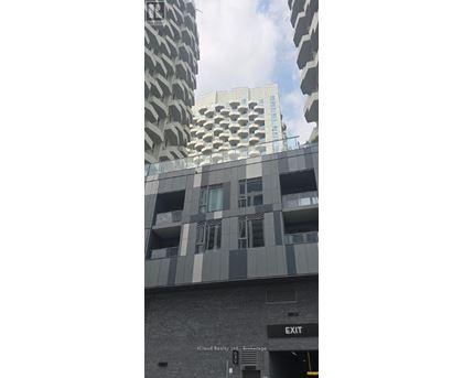 A building with a sign that says "EXIT" on the side.