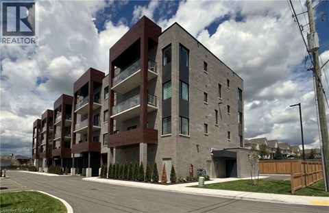 A modern multi-story building with a mix of brick and concrete exterior.