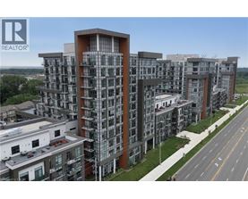 A large, modern apartment complex with a clear sky above.