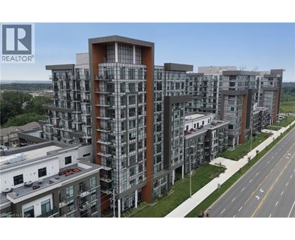 A large, modern apartment complex with a clear sky above.