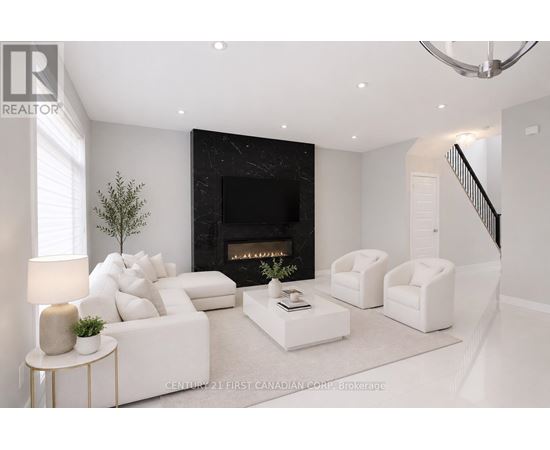 A modern living room with a fireplace and white furniture.
