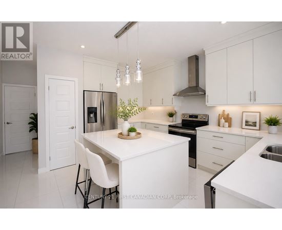 A modern kitchen with white cabinets and appliances.