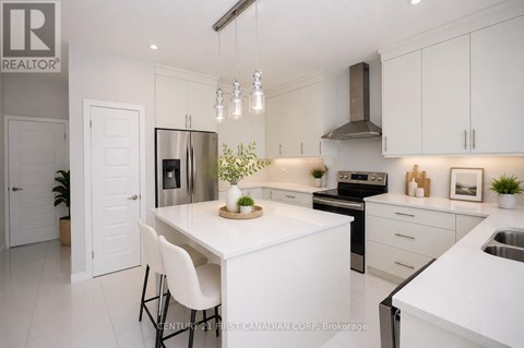 A modern kitchen with white cabinets and appliances.