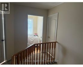 A bedroom with a bed and a window.