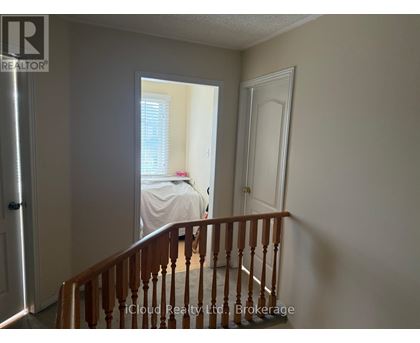 A bedroom with a bed and a window.