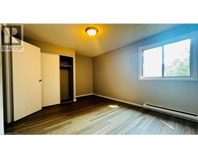 A room with a sliding door and a window.