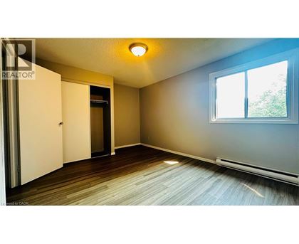 A room with a sliding door and a window.