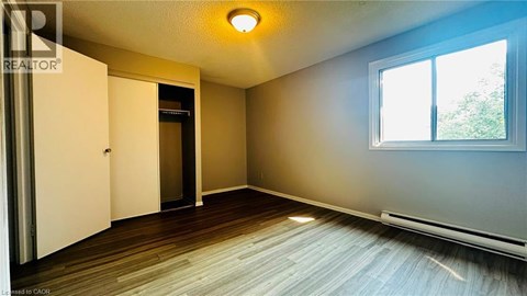 A room with a sliding door and a window.