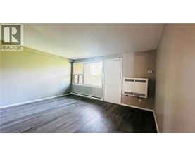 A room with a REALTOR sign on the wall.