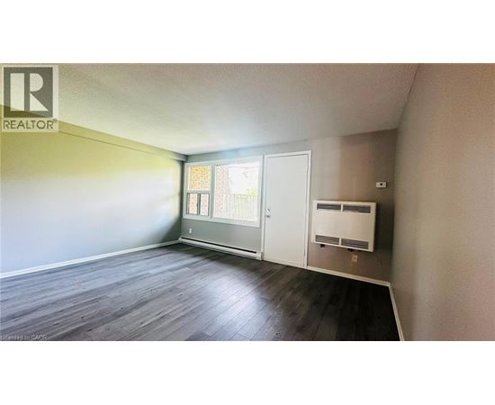 A room with a REALTOR sign on the wall.
