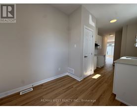 A room with a white door and a white cabinet.